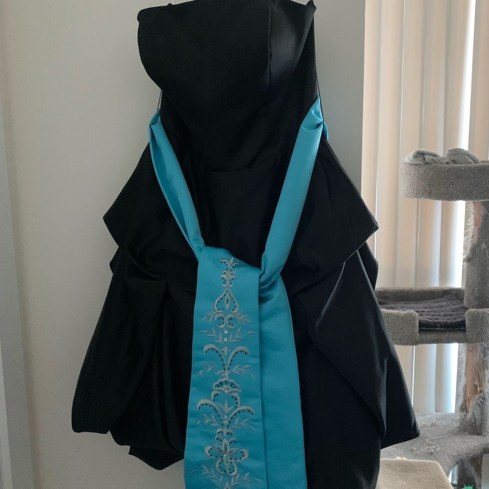 Strapless Prom dress size 4 ruched skirt with tule and baby blue sash.